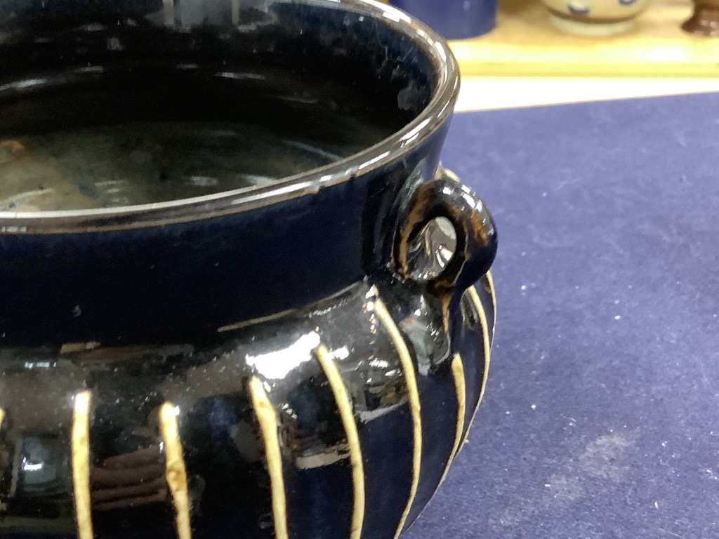 A Chinese blackware ribbed jar, a small blackware vase and a russet and black glazed jar, Yuan dynasty or later